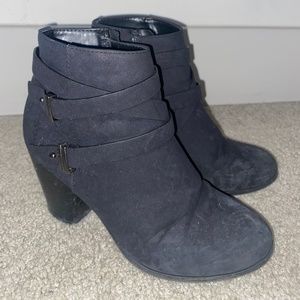 Worn black booties